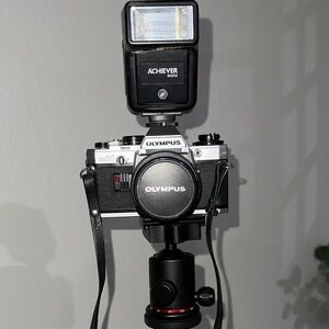 Olympus Black and Silver Camera with Achiever Flash